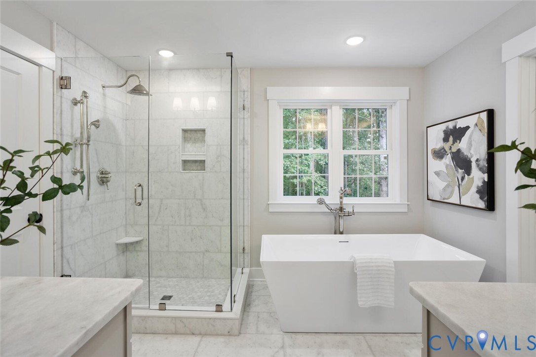 13800 Summerlook Lane Chesterfield, VA 23832 - Photo 28 of 49 a bathroom with a tub a sink and window