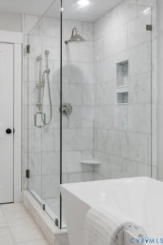 a bathroom with a shower and bathtub