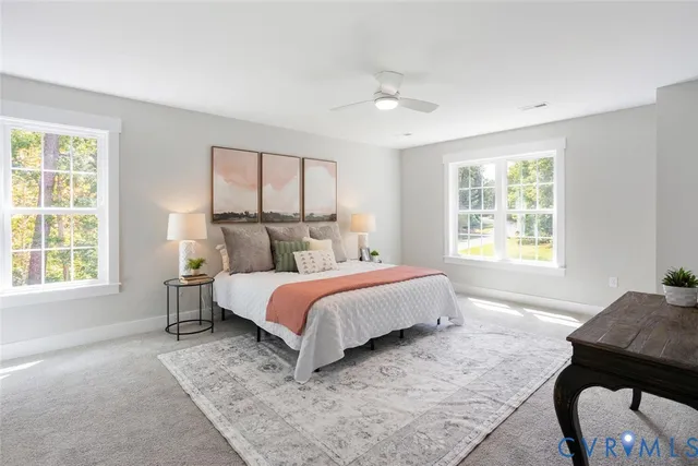 a bed room with a bed and a chair