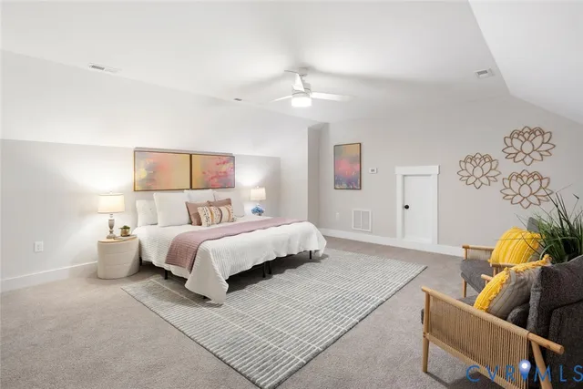 a bed room with a bed and a couch