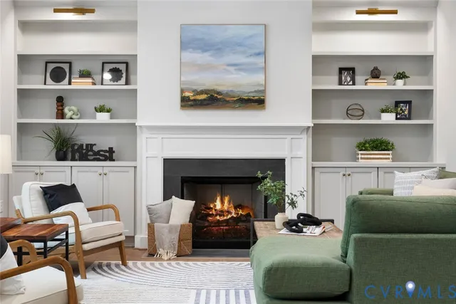 a living room with furniture and a fireplace