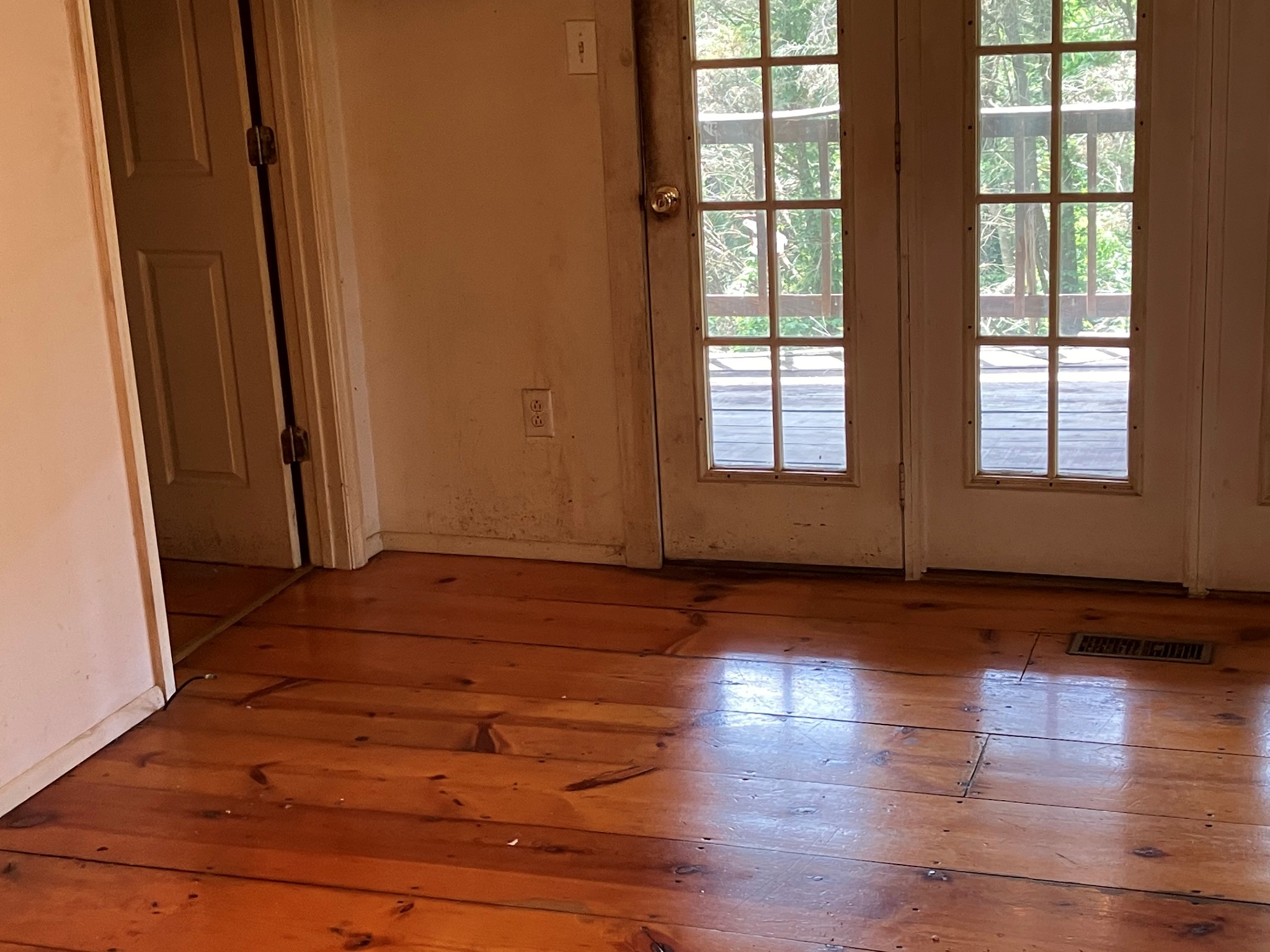 2029 Old Lake Road Lewisburg, TN 37091 - Photo 5 of 23 an empty room with wooden floor and windows