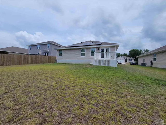 a view of balcony with wooden floor and fence