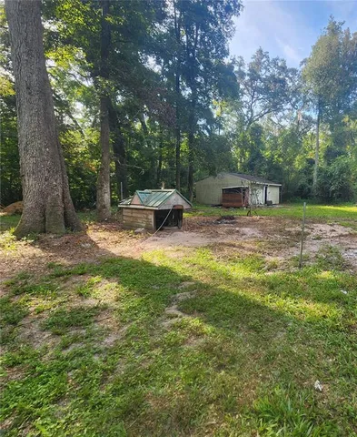 a view of a yard with an outdoor space