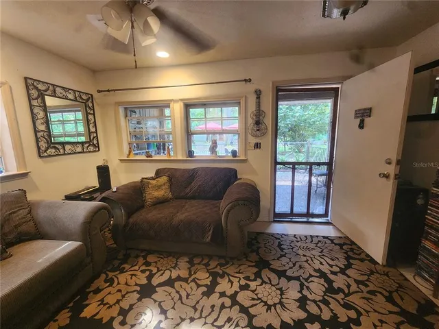 a living room with furniture and a window
