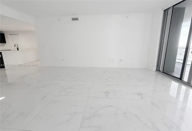 a spacious bathroom with a double vanity sink and a mirror