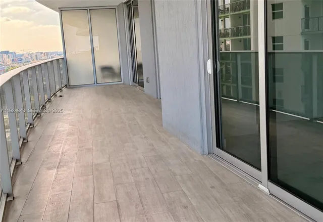 a spacious bedroom with a bed and a window