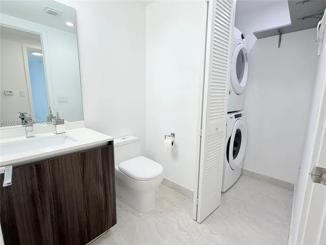 a view of a living room and chandelier