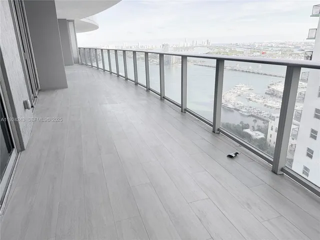 a view of a house with backyard porch and sitting area