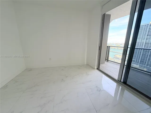 a view of a terrace with wooden floor and city view