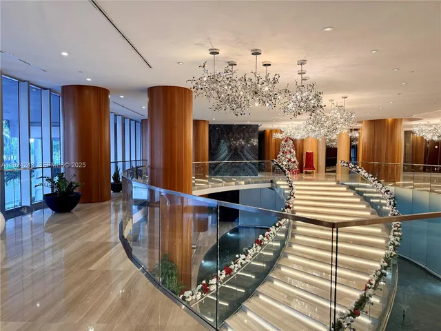 a view of a dining room with furniture and a window