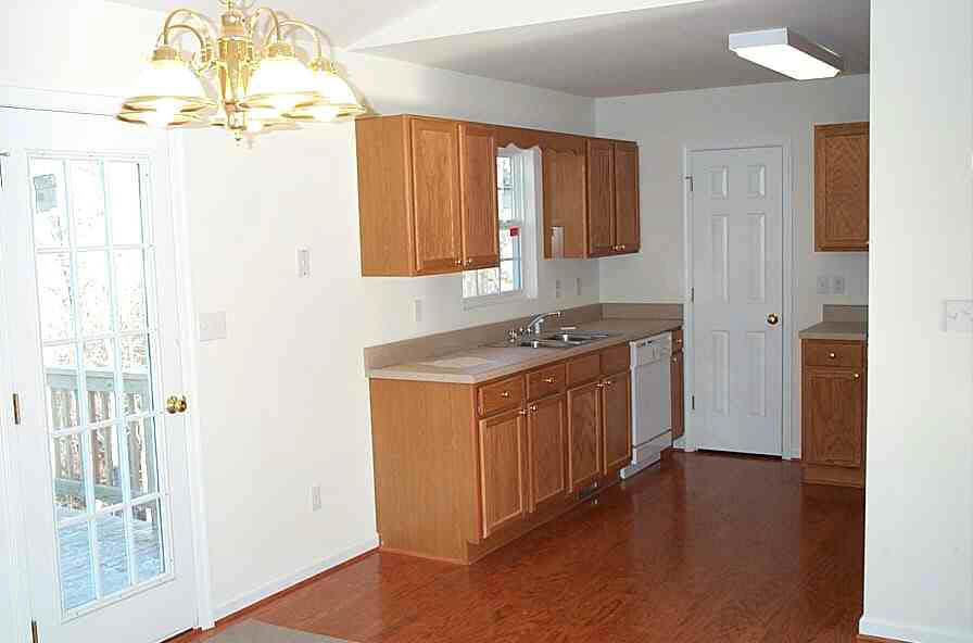 Brickhouse Road Louisa, VA 23093 - Photo 3 of 4 a utility room with cabinets wooden floor and windows