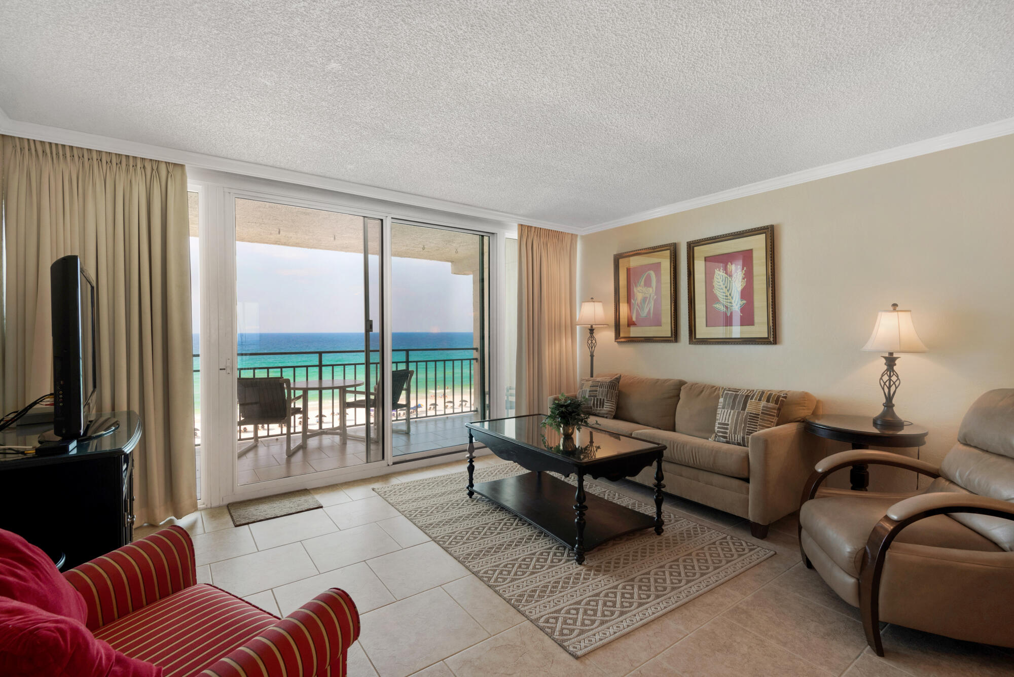 381 Santa Rosa Boulevard, Unit C611 Fort Walton Beach, FL 32548 - Photo 1 of 12 a living room with furniture and a flat screen tv