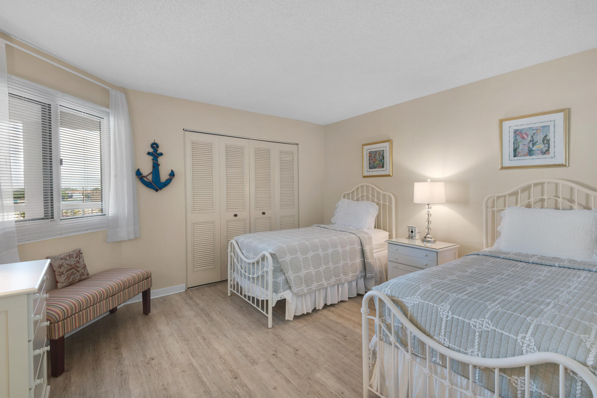 381 Santa Rosa Boulevard, Unit C611 Fort Walton Beach, FL 32548 - Photo 2 of 12 a bedroom with two beds and a couch