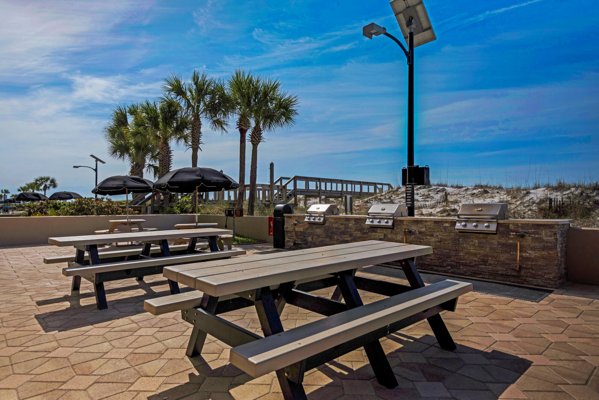 381 Santa Rosa Boulevard, Unit C611 Fort Walton Beach, FL 32548 - Photo 8 of 12 a swimming pool with outdoor seating