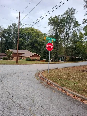 a view of a yard with a tree