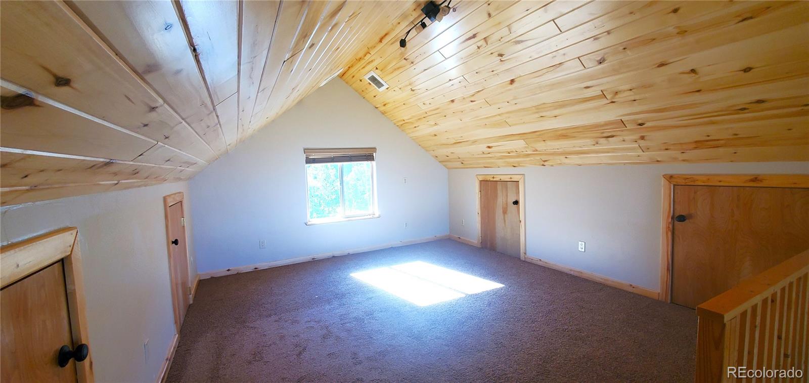 4984 Edmond Road Fort Garland, CO 81133 - Photo 12 of 24 a view of a livingroom with an empty space and a window