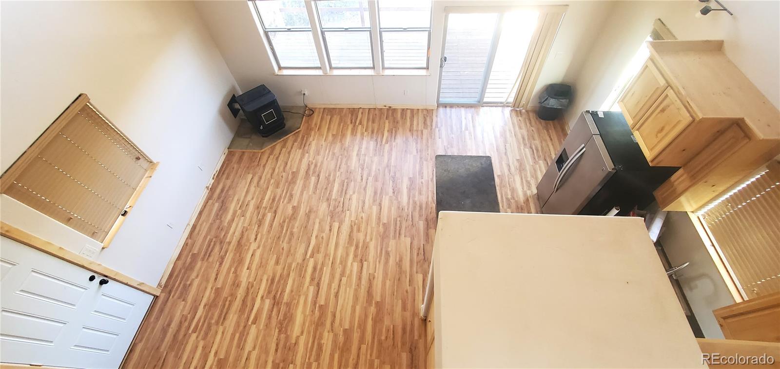 4984 Edmond Road Fort Garland, CO 81133 - Photo 13 of 24 a view of washer and dryer with wooden floor