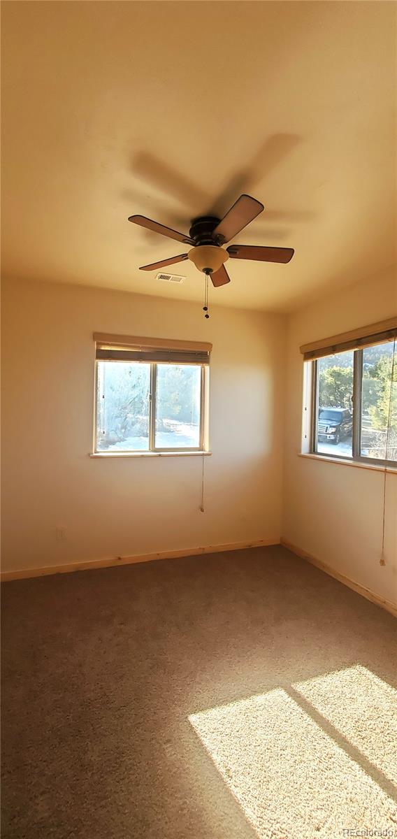 4984 Edmond Road Fort Garland, CO 81133 - Photo 18 of 24 a view of an empty room with a window