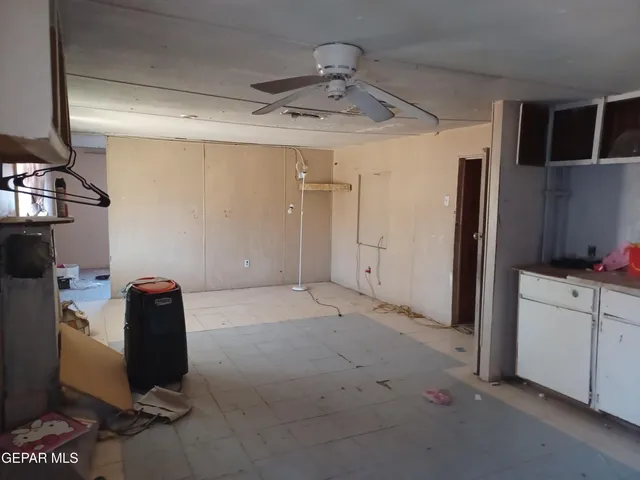 a view of a storage & utility room with two washing machine