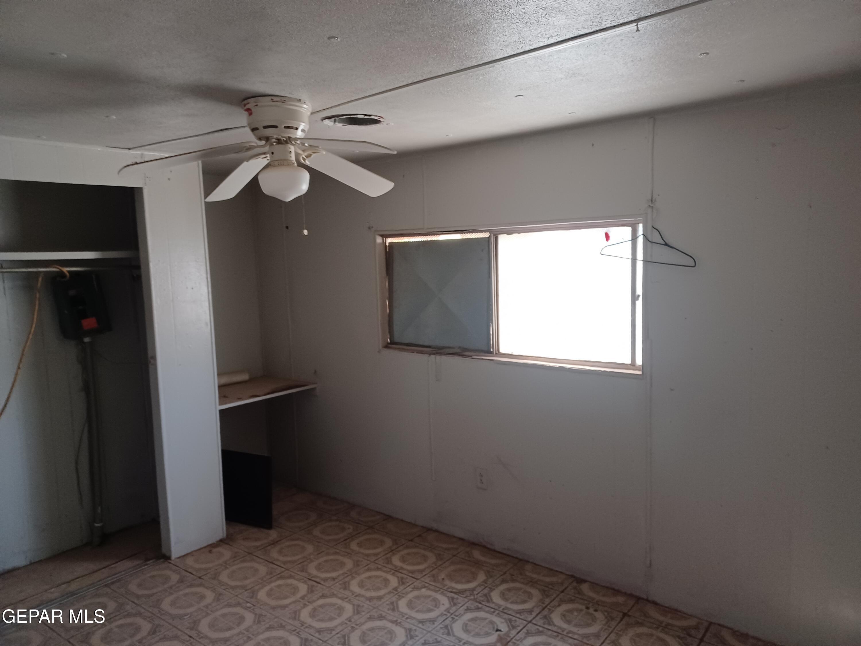 627 Milo Drive El Paso, TX 79927 - Photo 12 of 21 a view of empty room with windows and ceiling fan