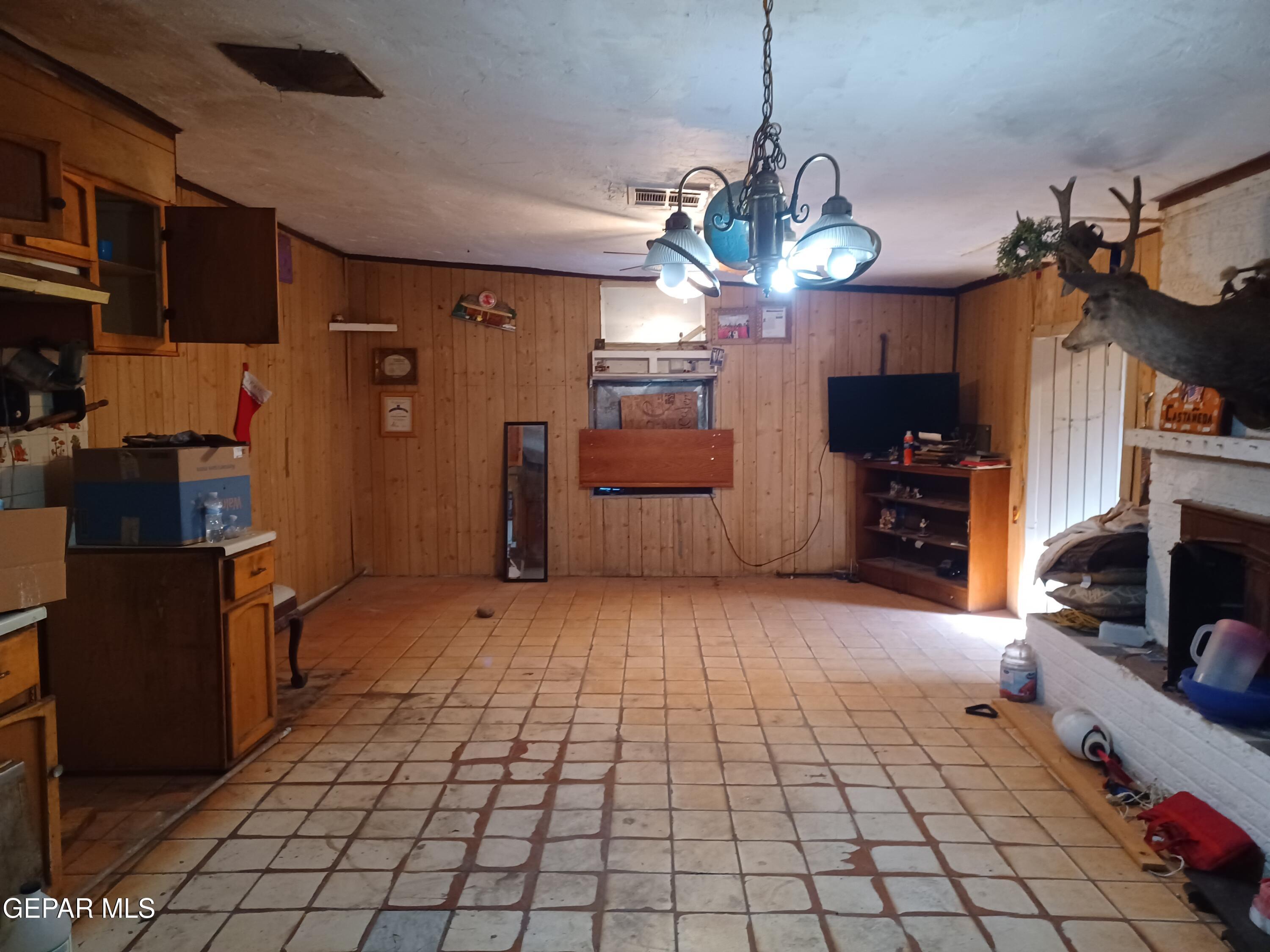 627 Milo Drive El Paso, TX 79927 - Photo 4 of 21 a view of a livingroom with furniture and a chandelier