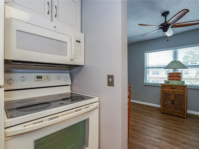 a kitchen with a stove and a microwave