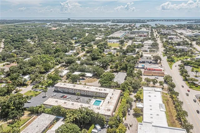 an aerial view of residential houses with outdoor space