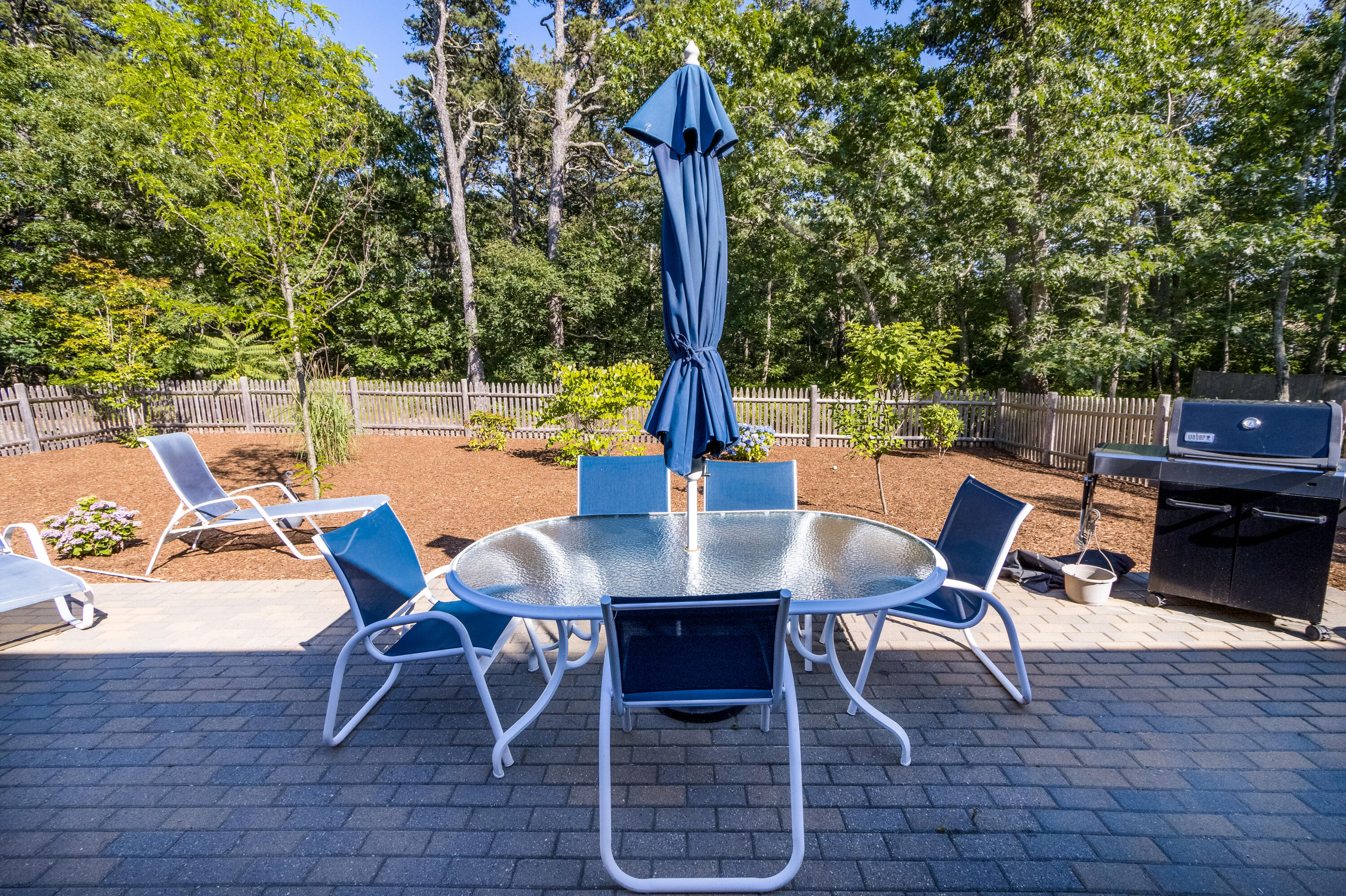 40 Pine Needle Road Wellfleet, MA 02667 - Photo 11 of 36 a view of a dining table and chairs in the patio