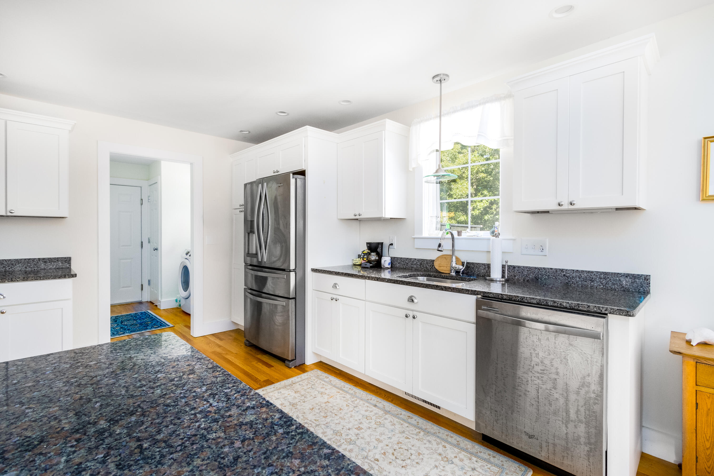 40 Pine Needle Road Wellfleet, MA 02667 - Photo 14 of 36 a kitchen with a refrigerator sink and stove