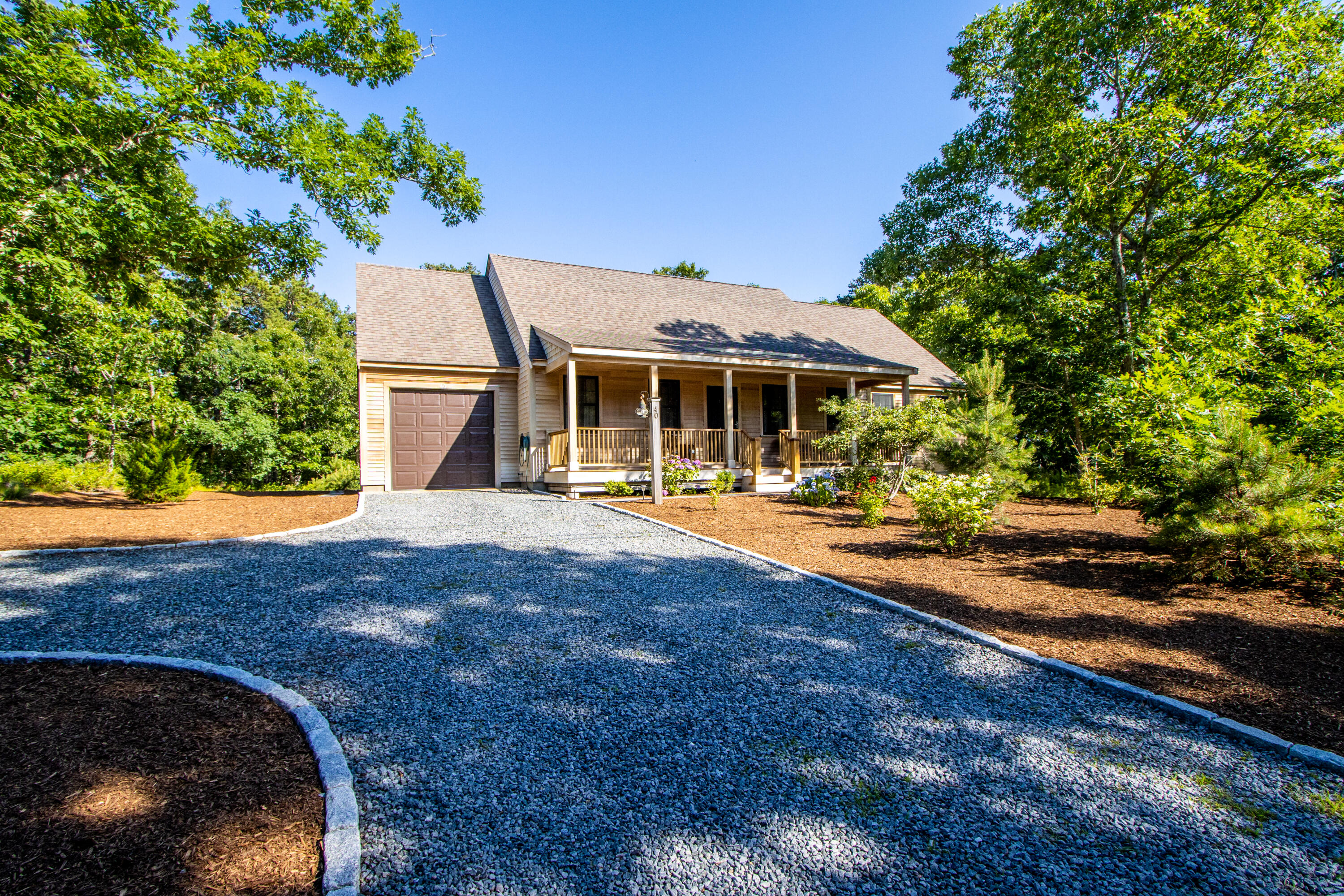 40 Pine Needle Road Wellfleet, MA 02667 - Photo 2 of 36 a view of a house with yard and sitting area