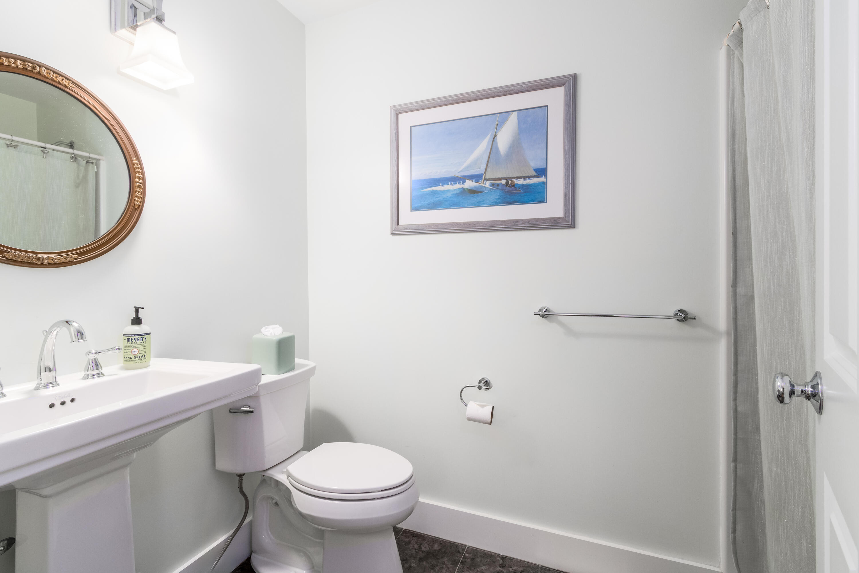 40 Pine Needle Road Wellfleet, MA 02667 - Photo 26 of 36 a bathroom with a toilet a sink and a mirror