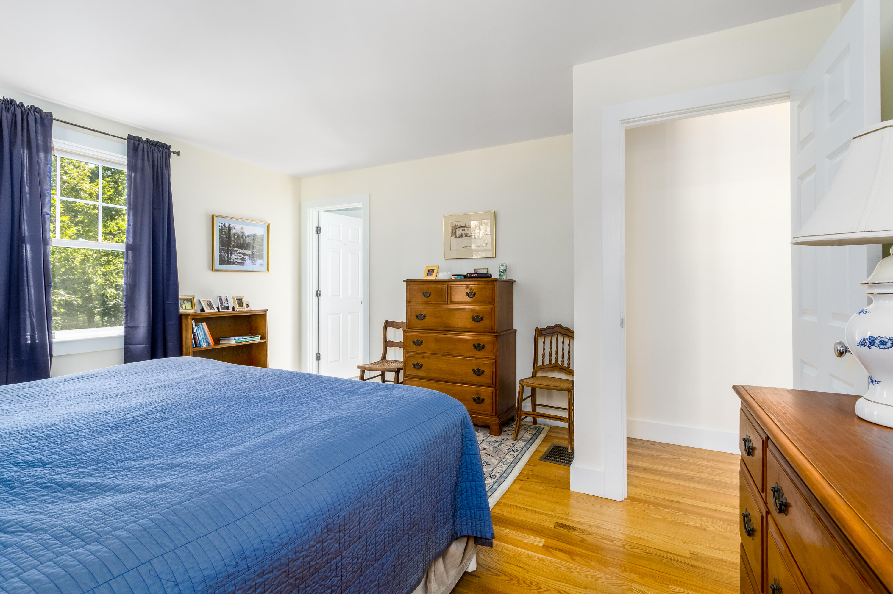 40 Pine Needle Road Wellfleet, MA 02667 - Photo 30 of 36 a bedroom with a bed and wooden floor