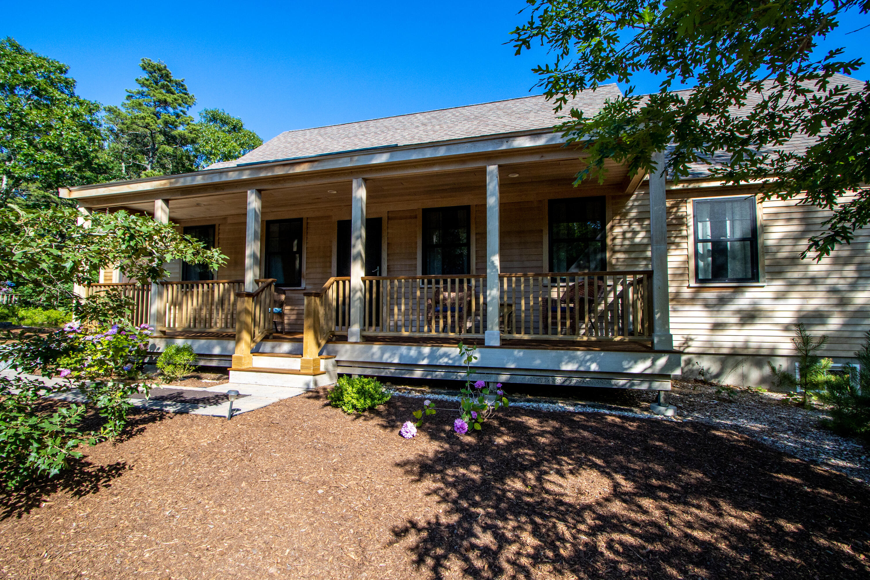 40 Pine Needle Road Wellfleet, MA 02667 - Photo 3 of 36 a front view of a house with sitting area