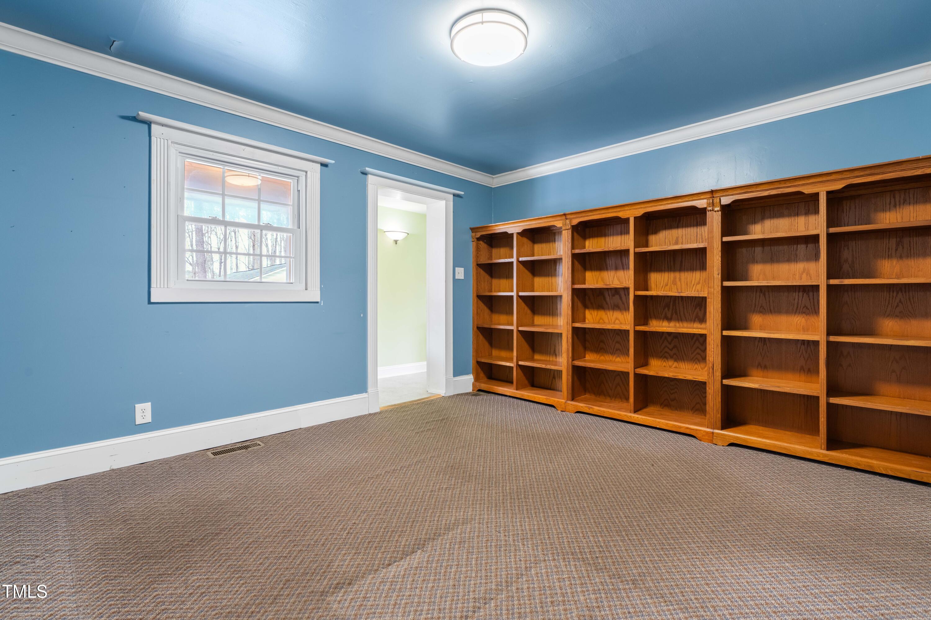 3617 Cranston Road Garner, NC 27529 - Photo 13 of 25 a view of an empty room with a balcony