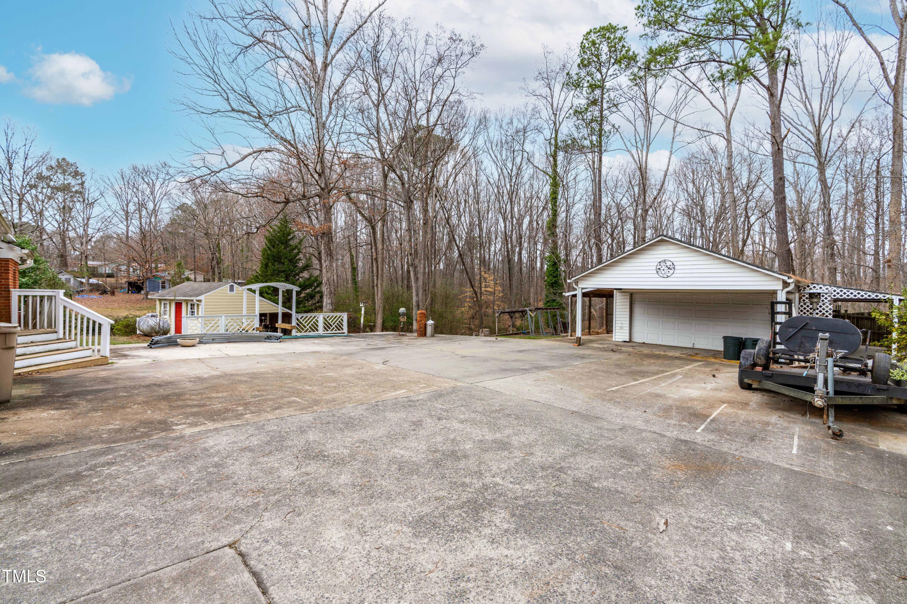 3617 Cranston Road Garner, NC 27529 - Photo 18 of 25 a view of a street with a car parked in front of it