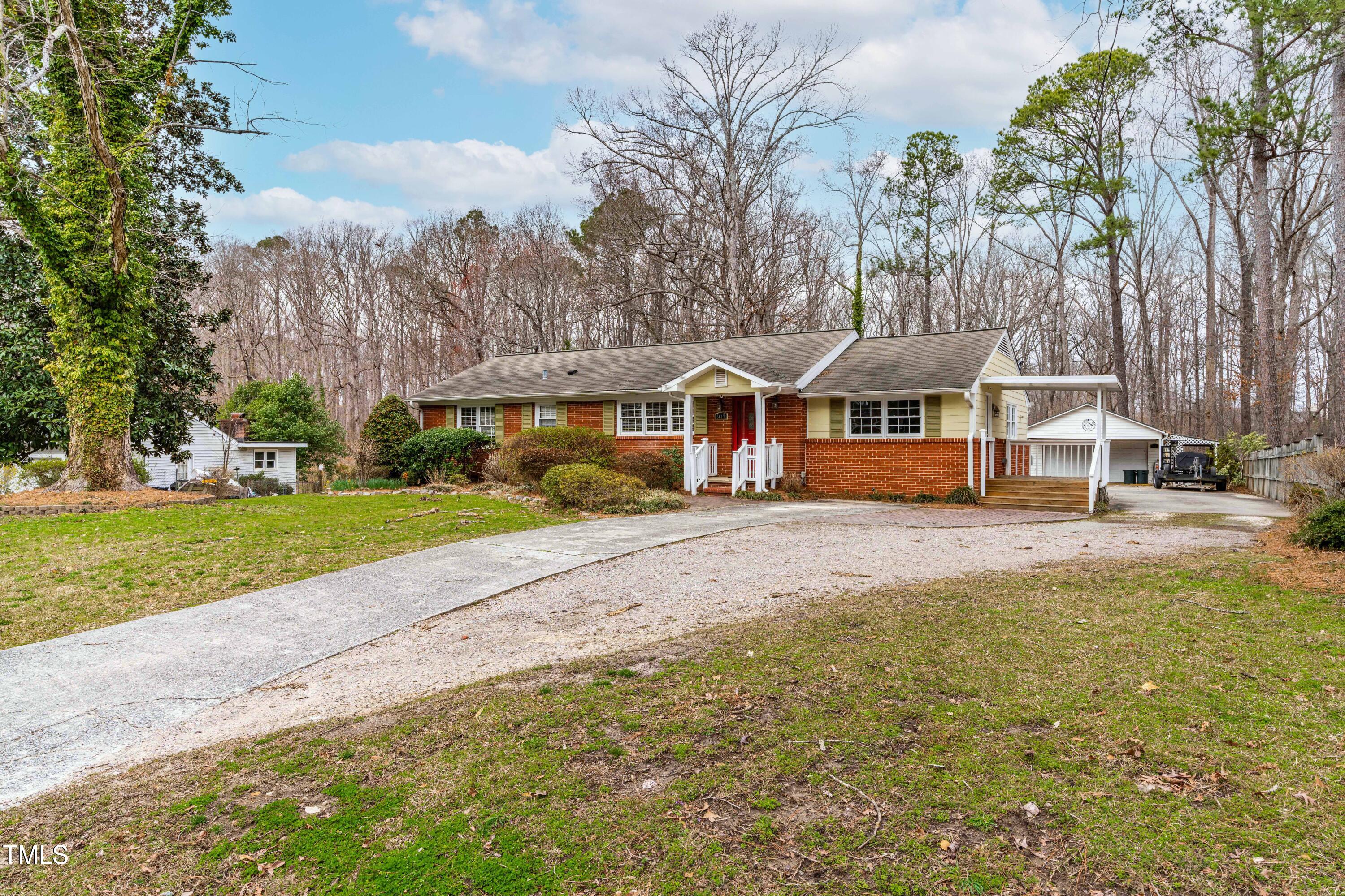 3617 Cranston Road Garner, NC 27529 - Photo 2 of 25 a view of a house with a big yard and sitting area
