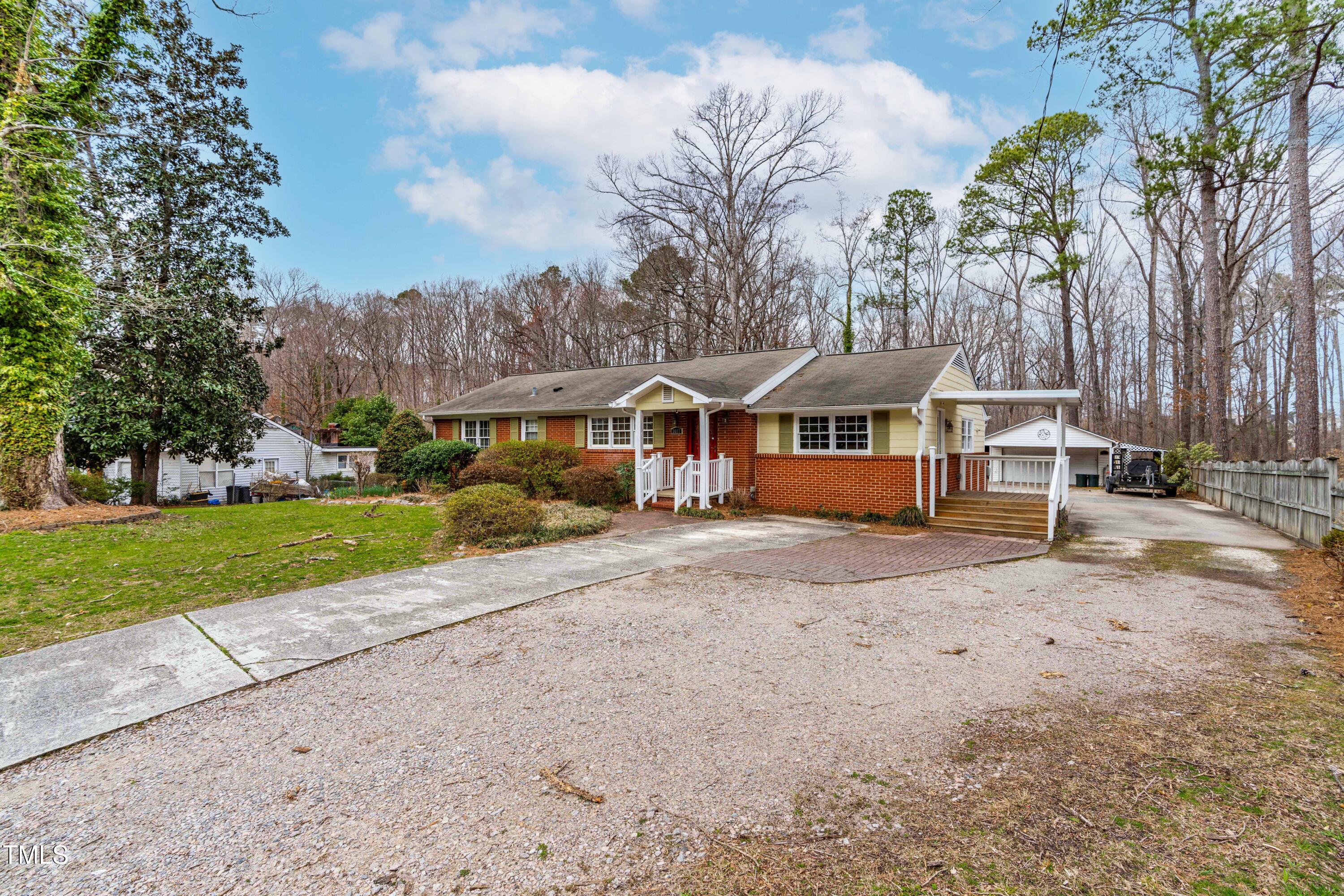 3617 Cranston Road Garner, NC 27529 - Photo 3 of 25 a front view of a house with a yard and garage