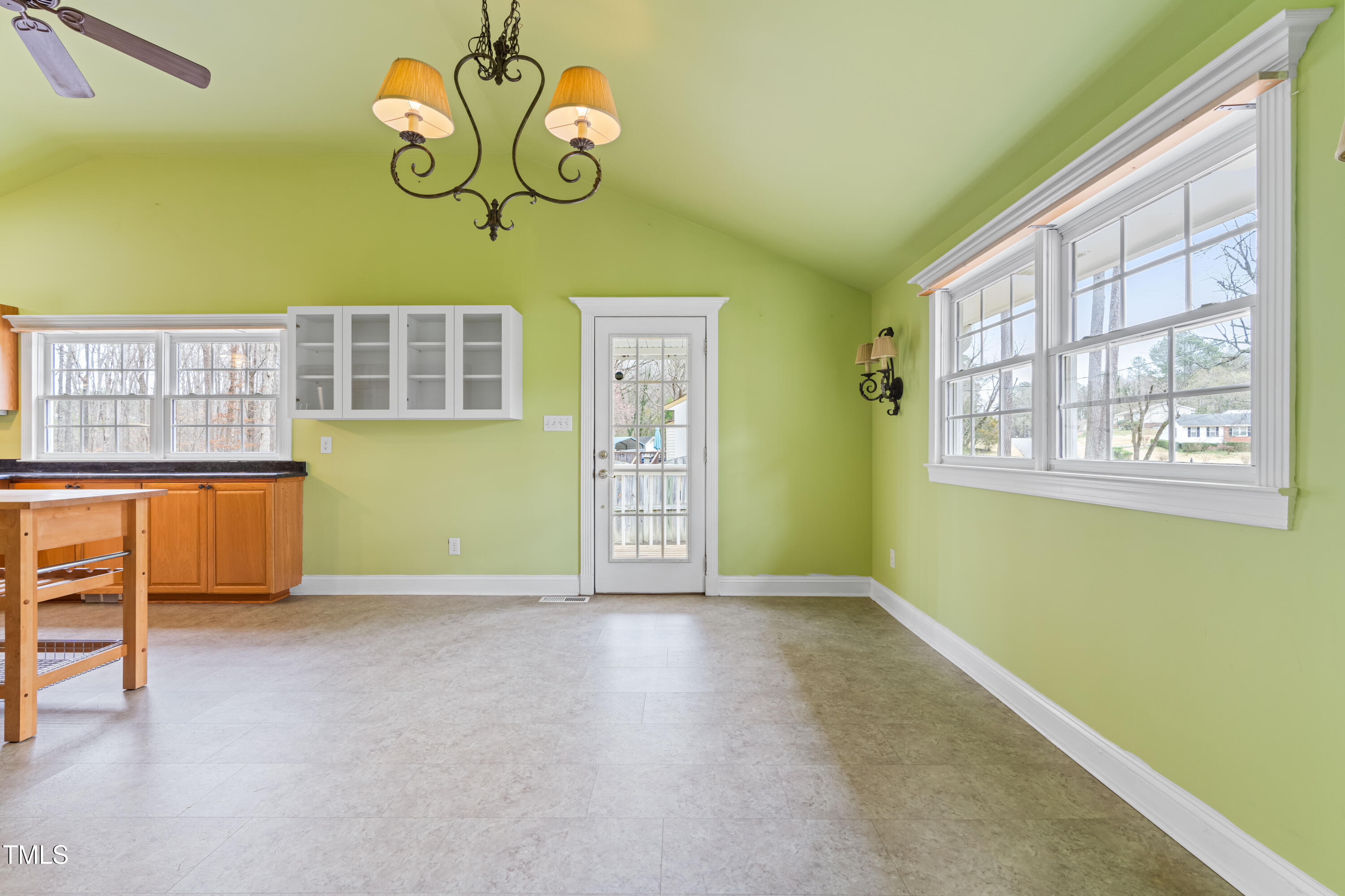 3617 Cranston Road Garner, NC 27529 - Photo 7 of 25 a view of an empty room with window and cabinet