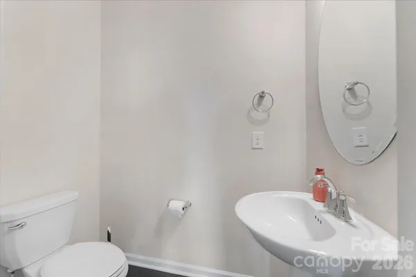 a bathroom with a toilet and a sink