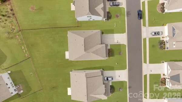 an aerial view of residential house with pool