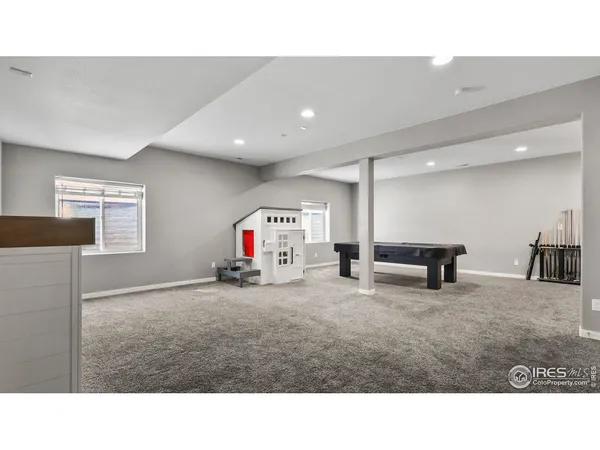 a room with furniture and a flat screen tv