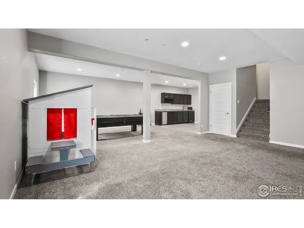 a room with furniture and a ceiling fan