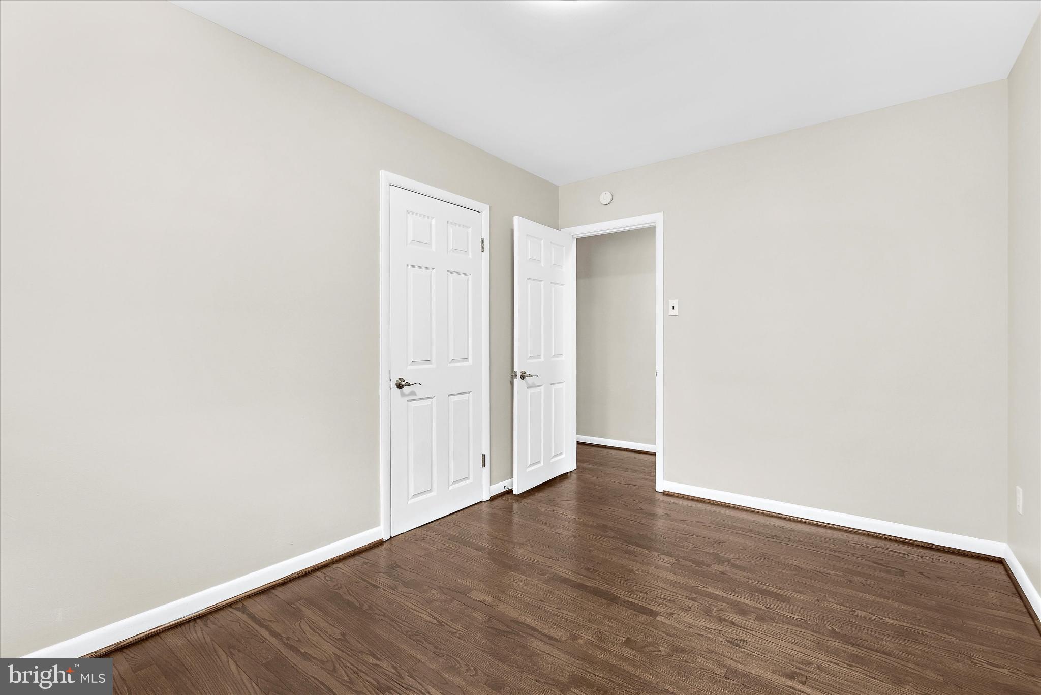 8421 Spring Road Pasadena, MD 21122 - Photo 12 of 30 a view of an empty room with wooden floor