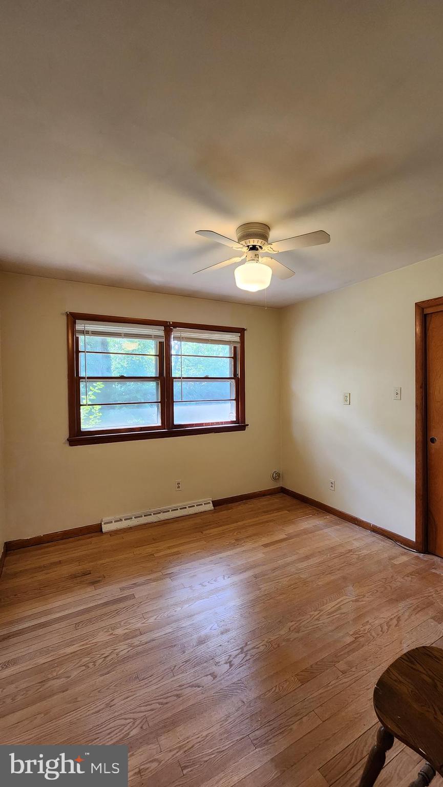 202 Holly Street Glassboro, NJ 08028 - Photo 10 of 14 an empty room with wooden floor