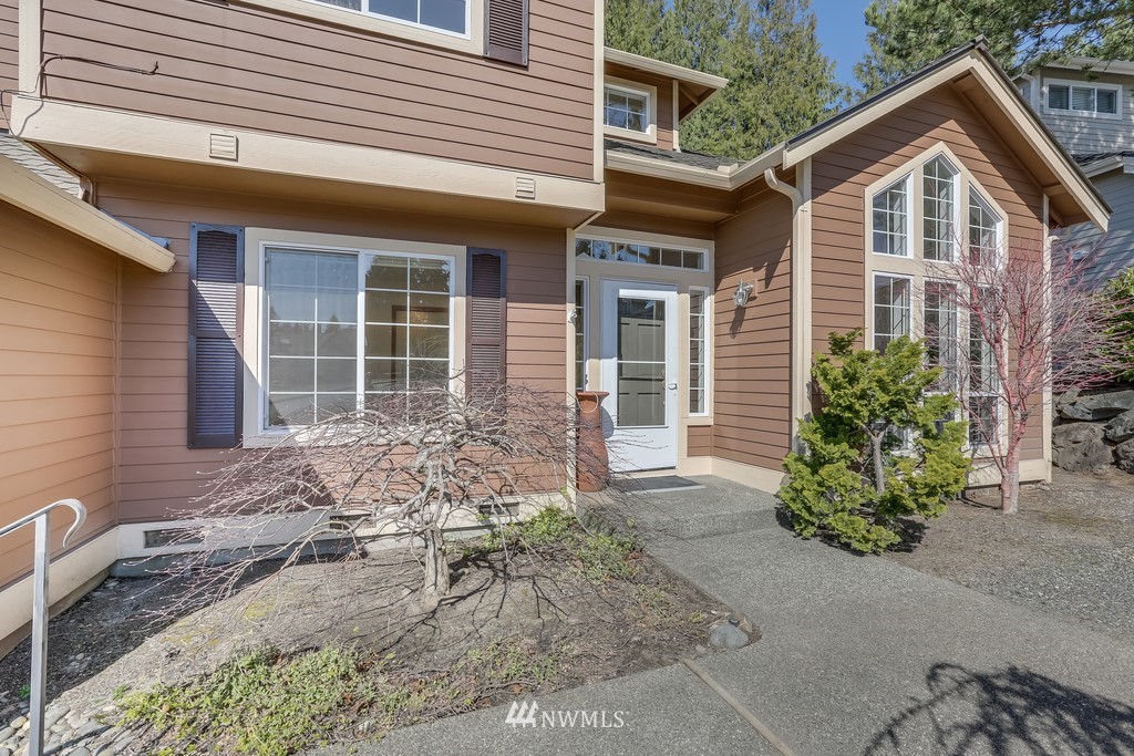 5006 Northeast 18th Court Renton, WA 98059 - Photo 3 of 35 a front view of a house with garden