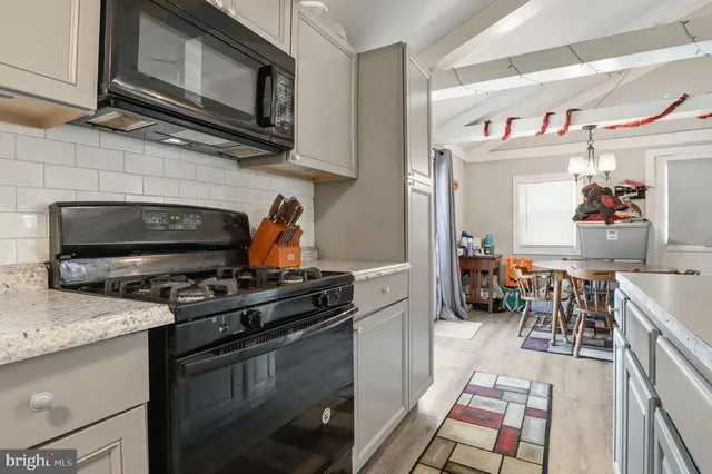 a kitchen with a sink stove and refrigerator
