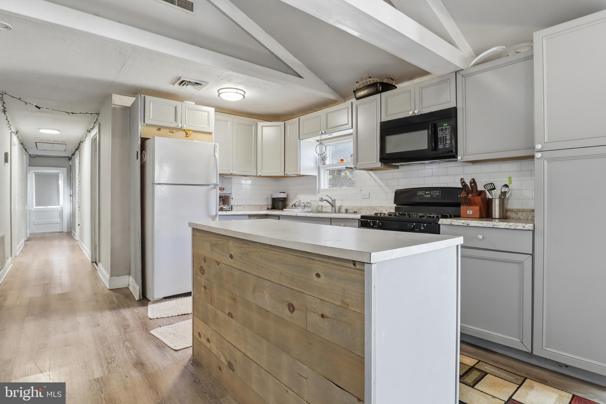 1744 Ridge Road York Springs, PA 17372 - Photo 14 of 30 a kitchen with a refrigerator stove and microwave