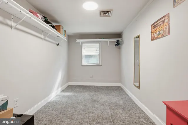 a room with furniture and white walls