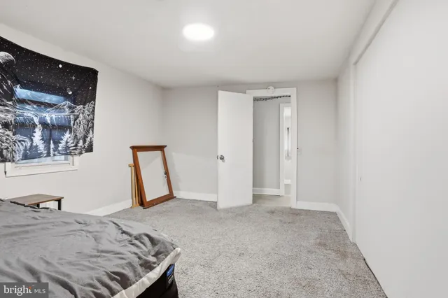 a utility room with cabinets and washer